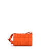 Pre-owned Bottega Veneta orange small cassette crossbody bag in maxi intrecciato leather.